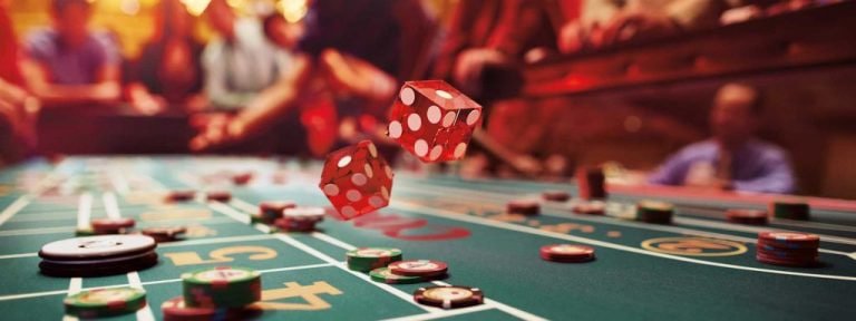 Live casino blackjack table with dealer and players
